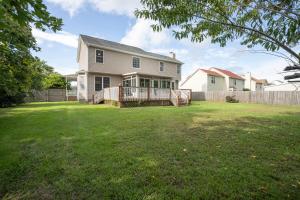 a yard with a house and a fence at Beautiful home near Marine Corps base in Jacksonville