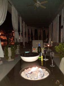 a table with a plate of food and wine glasses at Cozy Turret Room at Nottingham Place in Wise with Plush Queen Bed, Private Detached Full Bath in Wise