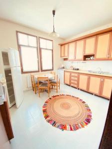 a kitchen with a table and a dining room at ÇobanEvi Gökçeada sakin,huzurlu... in Gokceada Town