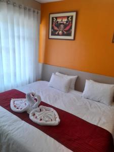 Postel nebo postele na pokoji v ubytování HOSTAL CASA INKAS