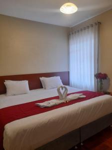 Postel nebo postele na pokoji v ubytování HOSTAL CASA INKAS