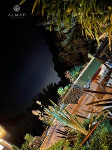 a view of a body of water at night at ALMAH GLAMPING in Cali +61 photos