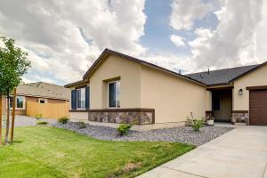 a home with a driveway and a house at Newly Built Sparks Home with Hot Tub 12 Mi to Reno! in Sparks