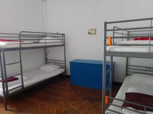 Postel nebo postele na pokoji v ubytování Old Évora Hostel