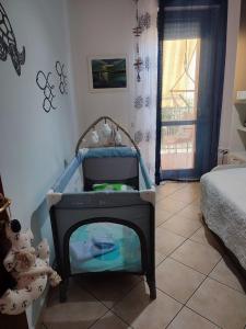 A bed or beds in a room at Rami di Corallo Appartamento con Parcheggio Privato ----------