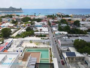 an aerial view of a city with the ocean at Condo Gallo in Cozumel