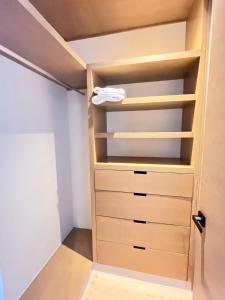 a walk in closet with drawers and shelves at Condo Gallo in Cozumel