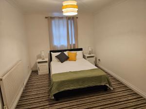 a bedroom with a bed and a window at Skyline Mansel in Swansea