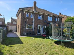 a house with a trampoline in the yard at 3 bedroom Semi detached in Erith