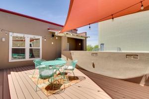 a patio with a table and chairs on a deck at Albuquerque Vacation Rental Less Than 1 Mi to Downtown! in Albuquerque
