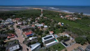 an aerial view of a small town next to the beach at Pousada Toca do Ceará in Regencia Augusta +7 photos