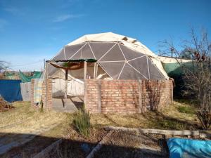 a yurt is set up in a field at RAMA GUEST HOUSE in Ciudad Lujan de Cuyo