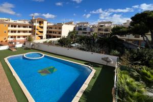 a large swimming pool on the side of a building at Roda, Sea and Golf in Roda