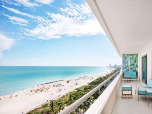 a balcony with a view of the beach at Faena Hotel Miami Beach in Miami Beach