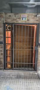 a gate in a building with a sign on it at Montevideo Apartamento centro a estrenar comodo in Montevideo