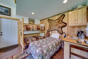 a bathroom with a bed and a sink in a room at Cozy Countryside Cabin in Robie Creek Park! in Boise