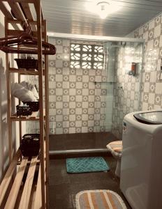 a bathroom with a shower and a toilet and a sink at Studio 1 casazul in Salvador