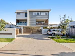 a house with a car parked in front of it at Beach City 3 Bedroom Modern Townhouse in Maroochydore