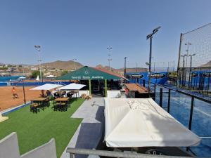 a batting cage with tables and chairs on a baseball field at Villa Habibi Luxury 5A in Chayofa