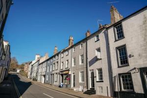 a row of buildings on a city street at Scotch Terrace - 3 Bed House in Whitehaven