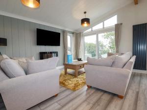 TV a/nebo společenská místnost v ubytování Mordros Lodge