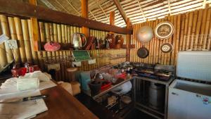 a kitchen with a counter and a sink in it at Village Life 