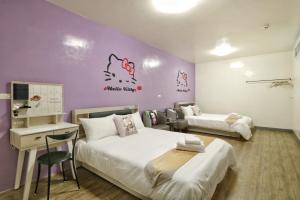 Ein Bett oder Betten in einem Zimmer der Unterkunft Wanghong Homestay