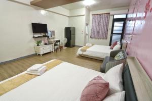 Ein Bett oder Betten in einem Zimmer der Unterkunft Wanghong Homestay