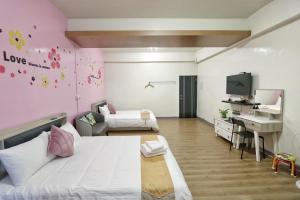 Ein Bett oder Betten in einem Zimmer der Unterkunft Wanghong Homestay