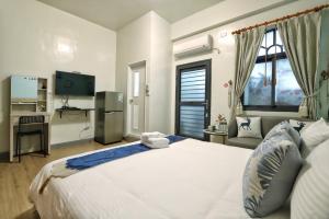 Ein Bett oder Betten in einem Zimmer der Unterkunft Wanghong Homestay