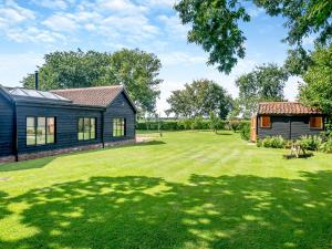 a home with a large yard with a house at Little Orchard in Wood Dalling