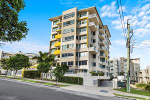 an apartment building on the side of a street at Nova Mooloolaba Beach Apartments in Mooloolaba