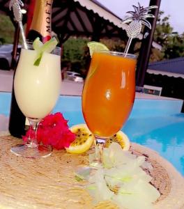 two drinks sitting on top of a table at Keshy island eden in Baillif