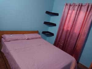 Un pat sau paturi într-o cameră la Arapoty apartamentos