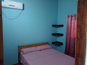 Un pat sau paturi într-o cameră la Arapoty apartamentos