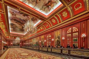 a large room with paintings on the walls at The Parisian Macao in Macau