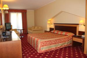 Postel nebo postele na pokoji v ubytování Hotel Grillo