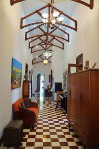 a living room with a checkered floor at Casa Blanca María Barranquilla - Authentic colonial house in Barranquilla