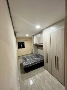 an empty room with a mattress in a room at casa de temporada Gabyviti in Sao Paulo