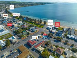 an aerial view of a city with the water at Aart Apartments in Port Lincoln