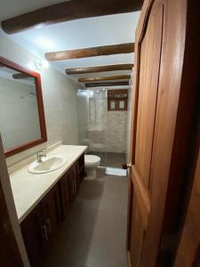 a bathroom with a sink and a toilet at Muisca Hotel Villa de Leyva in Villa de Leyva