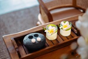a wooden box with a toy animal in it at Teratai Villa Canggu by Ini Vie Hospitality in Canggu