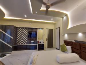 Ένα ή περισσότερα κρεβάτια σε δωμάτιο στο Hindusthan Inn - On Beach