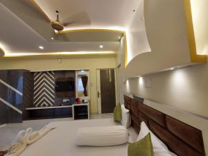 Ένα ή περισσότερα κρεβάτια σε δωμάτιο στο Hindusthan Inn - On Beach