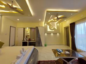 Ένα ή περισσότερα κρεβάτια σε δωμάτιο στο Hindusthan Inn - On Beach