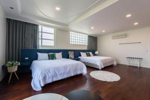 מיטה או מיטות בחדר ב-Slow Pine Homestay