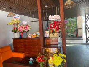 a flower shop with flowers in vases on a table at HomeStay 888 in Can Tho