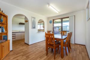 a kitchen and dining room with a table and chairs at Cables Beach House Lancelin in Lancelin