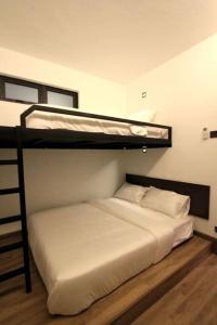 Postel nebo postele na pokoji v ubytování 新概念-新设计KonZept 1 house near Jonker&Heritage