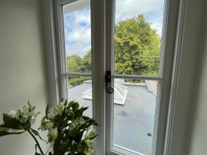 a window with a view of a street at 1 Aplands in Blandford Forum